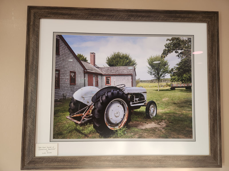 A vintage Ford tractor adds country flair to a charming New England landscape. This Massachusetts landscape incorporates both farmhouse and coastal themes.  Framed photograph by Luke Moore.
