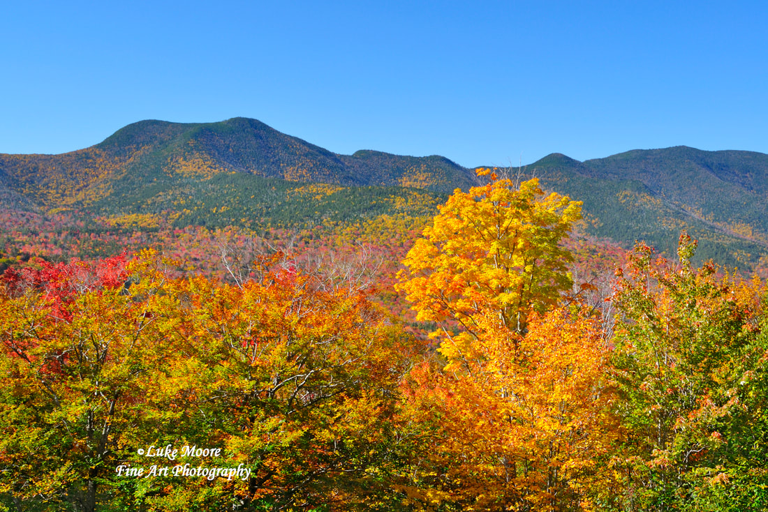 Beautiful autumn colors and vast mountains of New Hampshire.  Photography prints by Luke Moore.