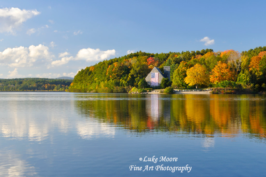 Colorful fall foliage surrounds the Old Stone Church in West Boylston, Massachusetts MA Worcester County.