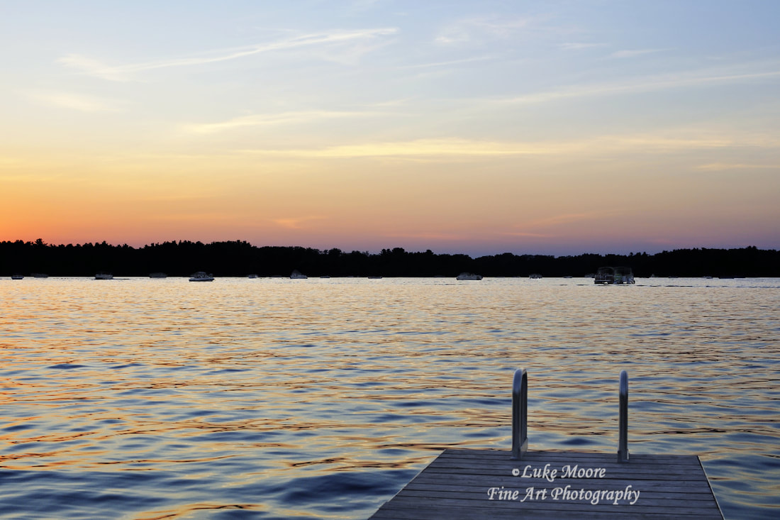 PictureThe dock and the beautiful, lake colors invite you for one last swim before the sun disappears completely. Webster Lake in Webster, Massachusetts, MA is known by a few other names including Lake Chaubunagungamaug and Lake Chargoggagoggmanchauggagoggchaubunagung